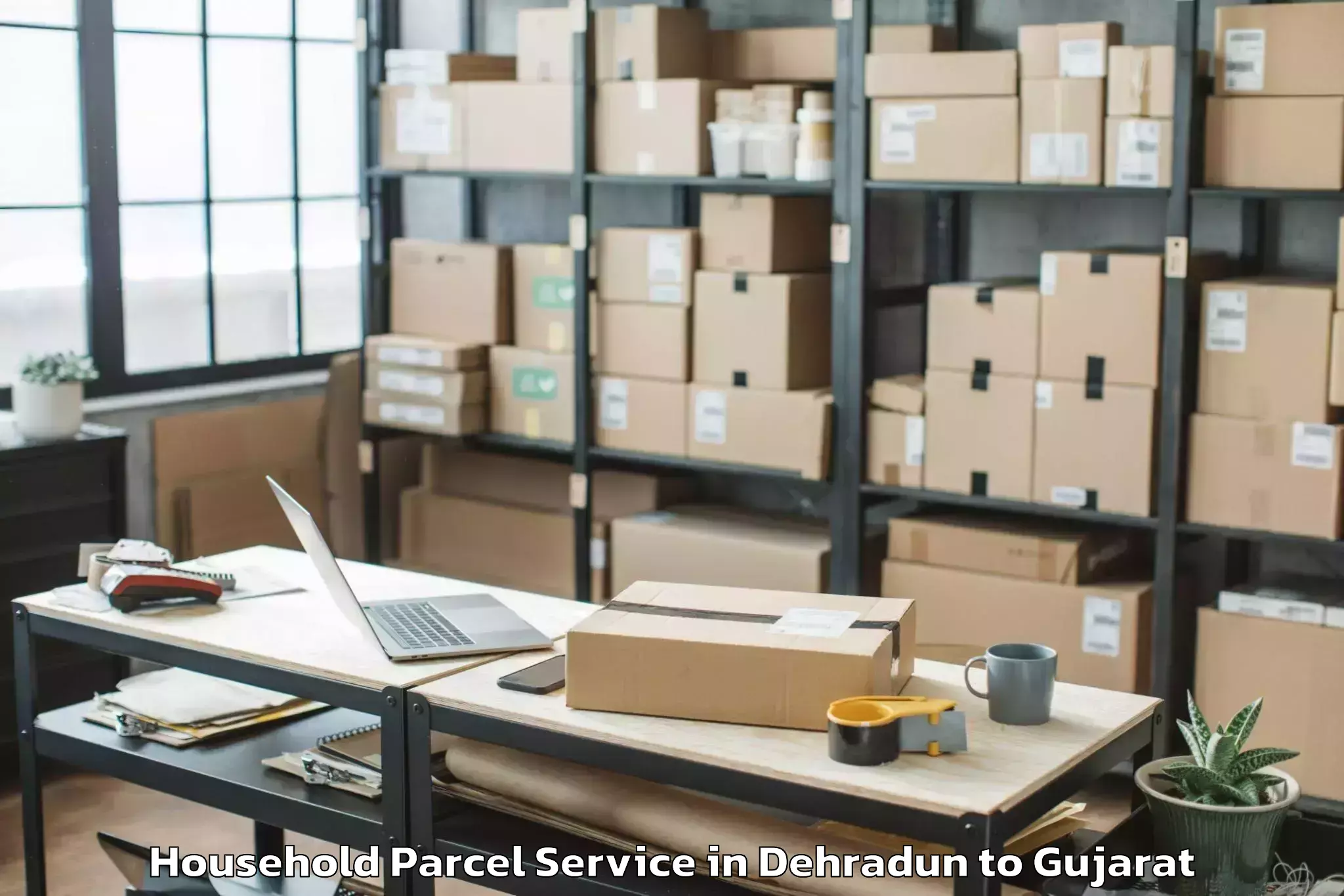 Book Your Dehradun to Keshod Airport Ixk Household Parcel Today